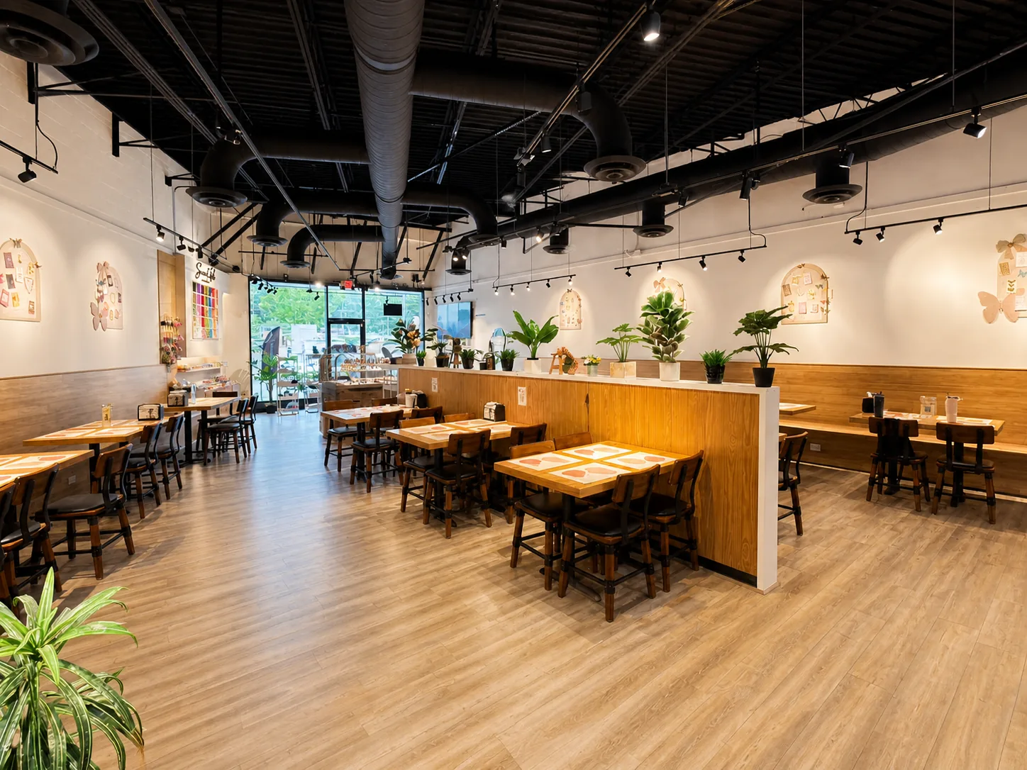 Open seating area with plants and warm lighting